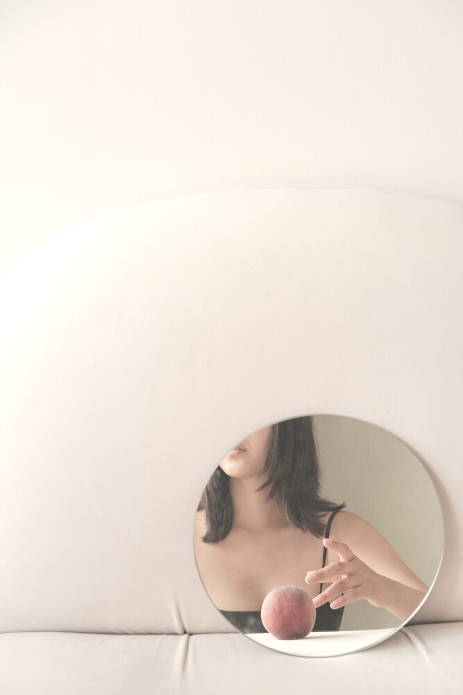 Woman as Seen on Round Mirror